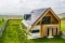 The picture shows a house with solar collectors.