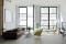 The picture shows a living room with generous proportions in an older building.