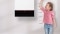 Futureproof Vitodens – the picture shows a girl next to a Viessmann Vitodens