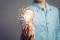 Light bulb in one hand as a symbol for smart metering